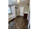 Bathroom with a soaking tub, a separate shower, a single vanity, and tiled flooring at 5580 Jamerson Dr, Atlanta, GA 30349