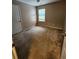 A bedroom with carpeted floors and a window at 5580 Jamerson Dr, Atlanta, GA 30349