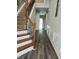 Inviting entryway with wood-look floors, stairs and decorative wood trim at 5580 Jamerson Dr, Atlanta, GA 30349
