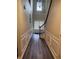 Inviting entryway featuring neutral walls, wood-look flooring and a staircase at 5580 Jamerson Dr, Atlanta, GA 30349
