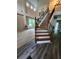 Bright foyer featuring wood staircase, wrought iron spindles and an airy feel at 5580 Jamerson Dr, Atlanta, GA 30349