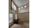 The living room has carpet flooring, neutral walls, tall ceilings, large windows, and vintage light fixture at 5580 Jamerson Dr, Atlanta, GA 30349