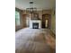 Cozy living room featuring a fireplace, large window, and neutral carpet at 5580 Jamerson Dr, Atlanta, GA 30349