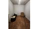 Bonus room with a recliner and laminate floors, offering a retreat for media or relaxation at 5580 Jamerson Dr, Atlanta, GA 30349