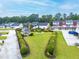 An aerial view showcasing the manicured common area complete with a gazebo and pond at 6330 Garden Cir, Douglasville, GA 30135