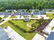 Aerial view of a meticulously landscaped community featuring green lawns and trees at 6330 Garden Cir, Douglasville, GA 30135