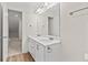 Bathroom boasts double sinks, spacious vanity, and warm lighting for a luxurious feel at 6330 Garden Cir, Douglasville, GA 30135