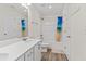 Clean bathroom with a shower-tub combo, bright lighting, and single sink vanity at 6330 Garden Cir, Douglasville, GA 30135