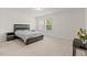 Bedroom featuring neutral carpet, a bed frame with storage, and a bright window at 6330 Garden Cir, Douglasville, GA 30135
