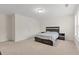 Spacious bedroom with neutral carpet, bed frame, and a bright window at 6330 Garden Cir, Douglasville, GA 30135