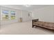 Spacious bedroom with two large windows and neutral carpet flooring for a comfortable space at 6330 Garden Cir, Douglasville, GA 30135