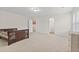 Large bedroom with plenty of natural light from the windows, carpet flooring, and ensuite bathroom at 6330 Garden Cir, Douglasville, GA 30135