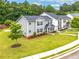 The townhome is surrounded by well-maintained lawns, lush greenery, and colorful flowerbeds at 6330 Garden Cir, Douglasville, GA 30135