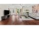 Cozy living room with dark hardwood floors, modern furniture, and a ceiling fan at 6330 Garden Cir, Douglasville, GA 30135