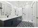 Modern bathroom features a double vanity, stylish tile flooring, and a glass-enclosed shower at 112 Rogers Ne St # 304, Atlanta, GA 30317