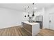 Contemporary kitchen with a large island, stainless steel appliances, and modern pendant lights at 112 Rogers Ne St # 304, Atlanta, GA 30317