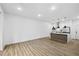 Spacious living area with modern flooring and a view of the stylish kitchen with stainless steel appliances at 112 Rogers Ne St # 304, Atlanta, GA 30317