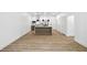 Open-concept living space featuring sleek floors and a modern kitchen with an island, ideal for entertaining at 112 Rogers Ne St # 304, Atlanta, GA 30317