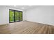 Bright, airy living space with large windows offering scenic views of lush greenery at 112 Rogers Ne St # 304, Atlanta, GA 30317