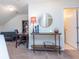 A cozy loft with a sofa, desk, shelf, and a table with a lamp, perfect for relaxation or study at 240 Orchard Dr, Covington, GA 30014