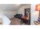 A cozy loft with a sofa, desk, and shelf, perfect for relaxation or study at 240 Orchard Dr, Covington, GA 30014