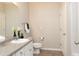 Clean bathroom features a vanity with sink and ample lighting at 240 Orchard Dr, Covington, GA 30014