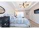 Relaxing bedroom features soft bedding, neutral colors, and a spacious closet at 240 Orchard Dr, Covington, GA 30014