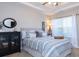 Relaxing bedroom features soft bedding, neutral colors, and a spacious closet at 240 Orchard Dr, Covington, GA 30014