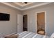 Relaxing bedroom features soft bedding, neutral colors, and a spacious closet at 240 Orchard Dr, Covington, GA 30014