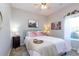 Inviting bedroom with comfortable bedding, soft lighting, and Parisian decor at 240 Orchard Dr, Covington, GA 30014