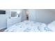 This bedroom features a light color scheme, a large dresser with a mirror, and a decorative blue lamp at 240 Orchard Dr, Covington, GA 30014