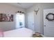Cozy bedroom with Parisian decor, soft lighting, and neutral walls at 240 Orchard Dr, Covington, GA 30014