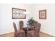 Cozy dining area featuring a glass table, upholstered chairs, and stylish decor at 240 Orchard Dr, Covington, GA 30014