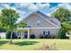 Charming home featuring manicured lawn and tasteful landscaping, creating inviting curb appeal at 240 Orchard Dr, Covington, GA 30014