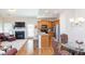 Cozy living room featuring a fireplace, modern kitchen with stainless steel appliances, and lots of natural light at 240 Orchard Dr, Covington, GA 30014