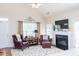 Bright, open living room featuring hardwood floors, fireplace, and comfortable seating at 240 Orchard Dr, Covington, GA 30014
