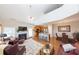 Spacious open-concept living area featuring a fireplace, adjacent kitchen, and hardwood floors at 240 Orchard Dr, Covington, GA 30014