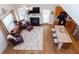 A stylish living room featuring a fireplace and an open-concept kitchen at 240 Orchard Dr, Covington, GA 30014