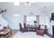 Bright, open living room featuring hardwood floors, fireplace, and comfortable seating at 240 Orchard Dr, Covington, GA 30014