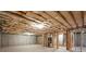 Unfinished basement with exposed ceiling, concrete walls, and stud framing ready for customization at 3950 Chattahoochee Rd, Cumming, GA 30041