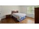 Comfortable bedroom with hardwood floors and a window with a view at 3950 Chattahoochee Rd, Cumming, GA 30041