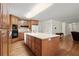 Spacious kitchen with wooden cabinets, modern appliances, and a large center island at 3950 Chattahoochee Rd, Cumming, GA 30041