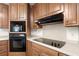 Close-up of the kitchen showing stainless steel appliances and cabinetry at 3950 Chattahoochee Rd, Cumming, GA 30041