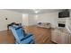 Spacious living room with hardwood floors, a fireplace and natural light beaming through windows at 3950 Chattahoochee Rd, Cumming, GA 30041