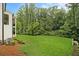 Spacious backyard with lush greenery, offering plenty of room for outdoor activities at 4757 Lake Forrest Drive Northwest Dr, Atlanta, GA 30342