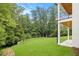 Expansive backyard featuring lush green lawn and mature trees, creating a private oasis at 4757 Lake Forrest Drive Northwest Dr, Atlanta, GA 30342