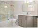 Modern bathroom features glass shower, gray vanity, and tiled floors at 4757 Lake Forrest Drive Northwest Dr, Atlanta, GA 30342
