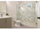 Bathroom with patterned shower tile, modern vanity, toilet and glass enclosed shower at 4757 Lake Forrest Drive Northwest Dr, Atlanta, GA 30342