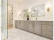 Bathroom featuring double vanity with framed mirrors, and lots of drawer and cabinet space for storage at 4757 Lake Forrest Drive Northwest Dr, Atlanta, GA 30342