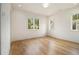 Sunlit bedroom with hardwood floors and large windows providing natural light and views at 4757 Lake Forrest Drive Northwest Dr, Atlanta, GA 30342